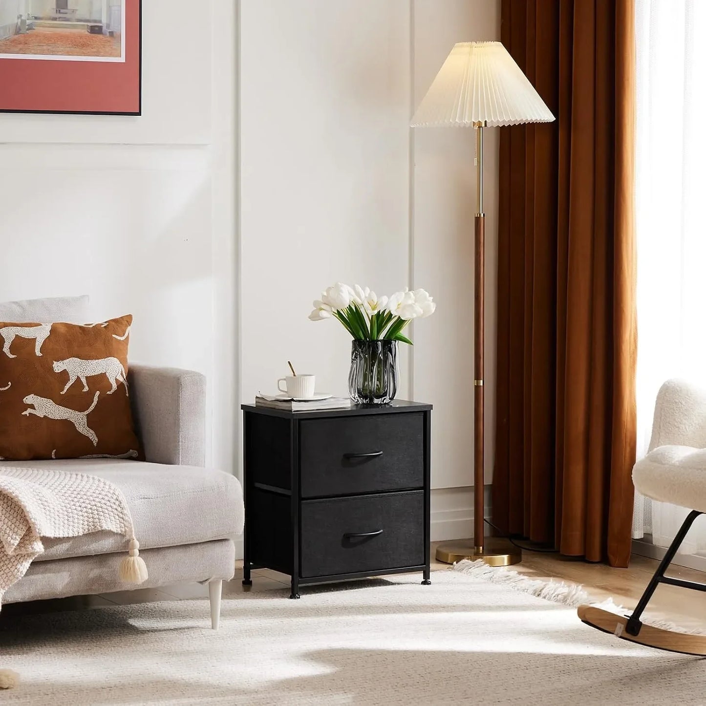 Black fabric nightstand styled beside seating in a living space