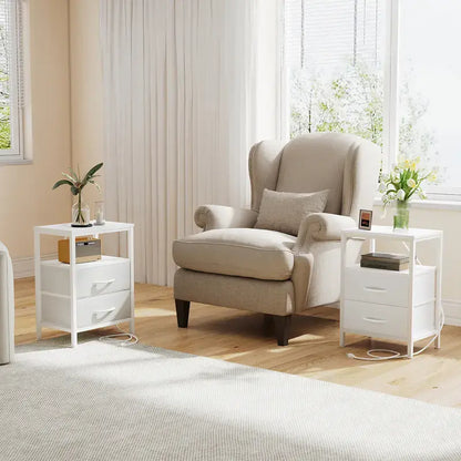 White nightstand beside a bed in a soft, bright bedroom