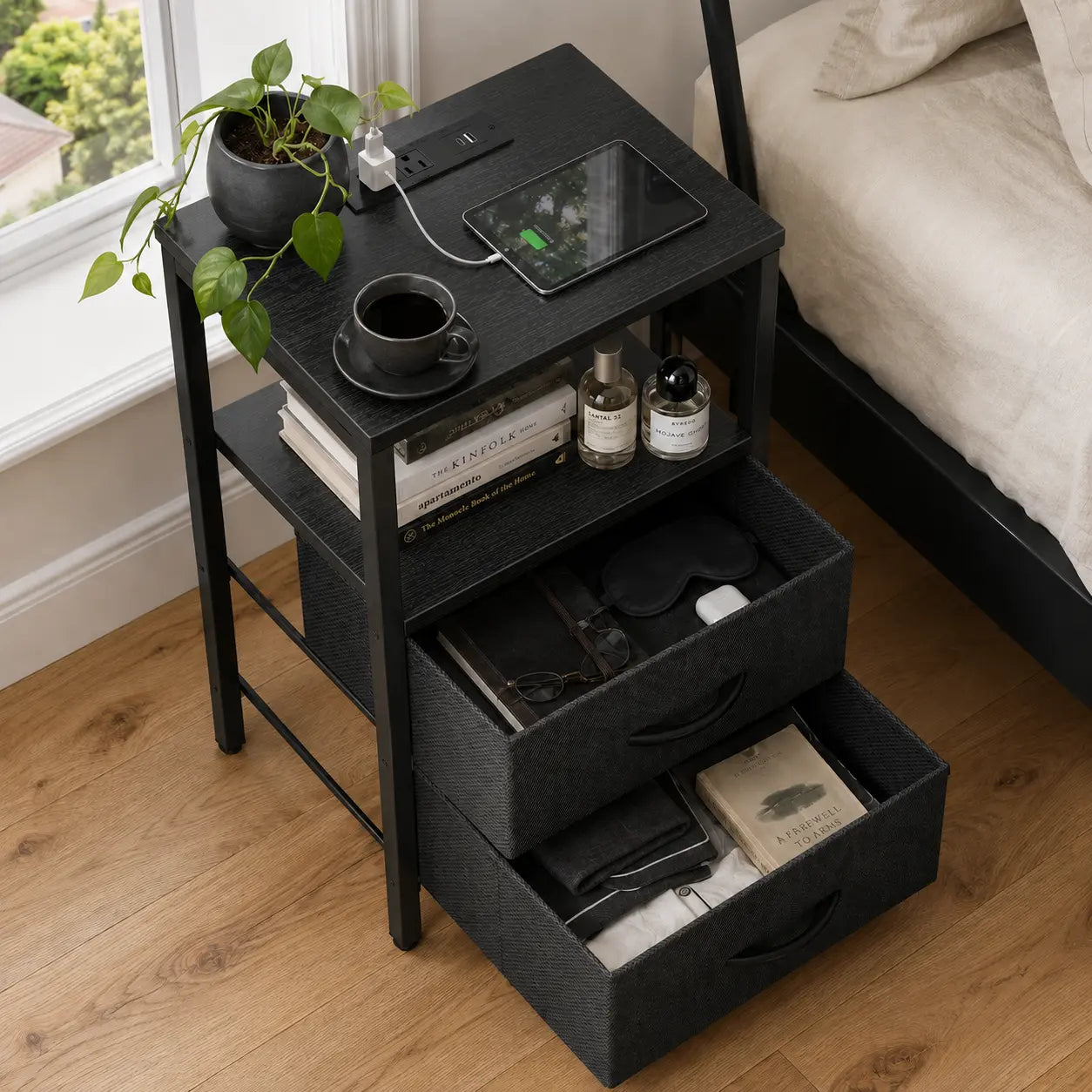 Black nightstand with its drawers pulled open