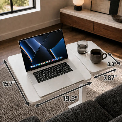 Overhead view of the workstation tabletop holding a laptop and desk essentials