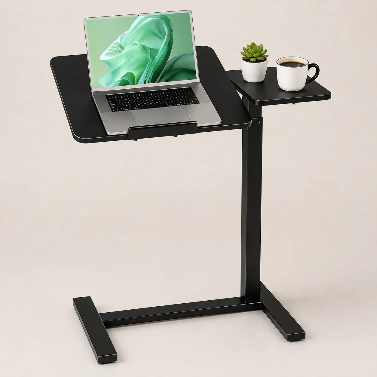 Black mobile workstation with laptop on an adjustable tabletop