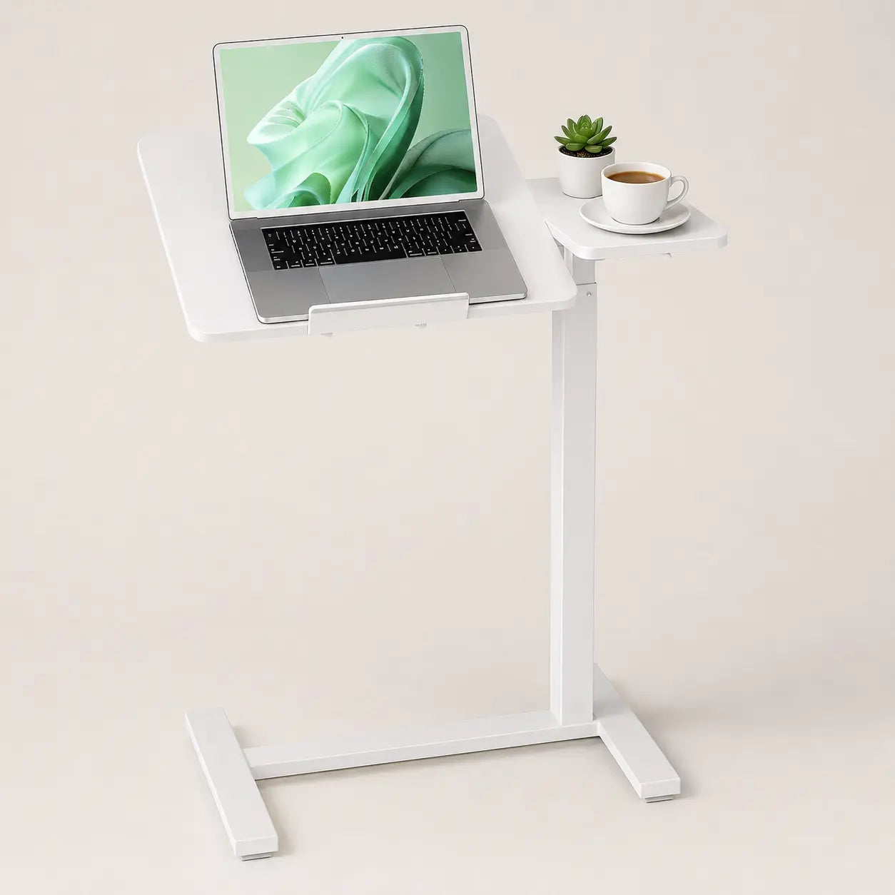 White mobile workstation with laptop on an adjustable tabletop